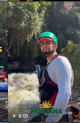 Guia da Montana de capacete verde às margens do rio